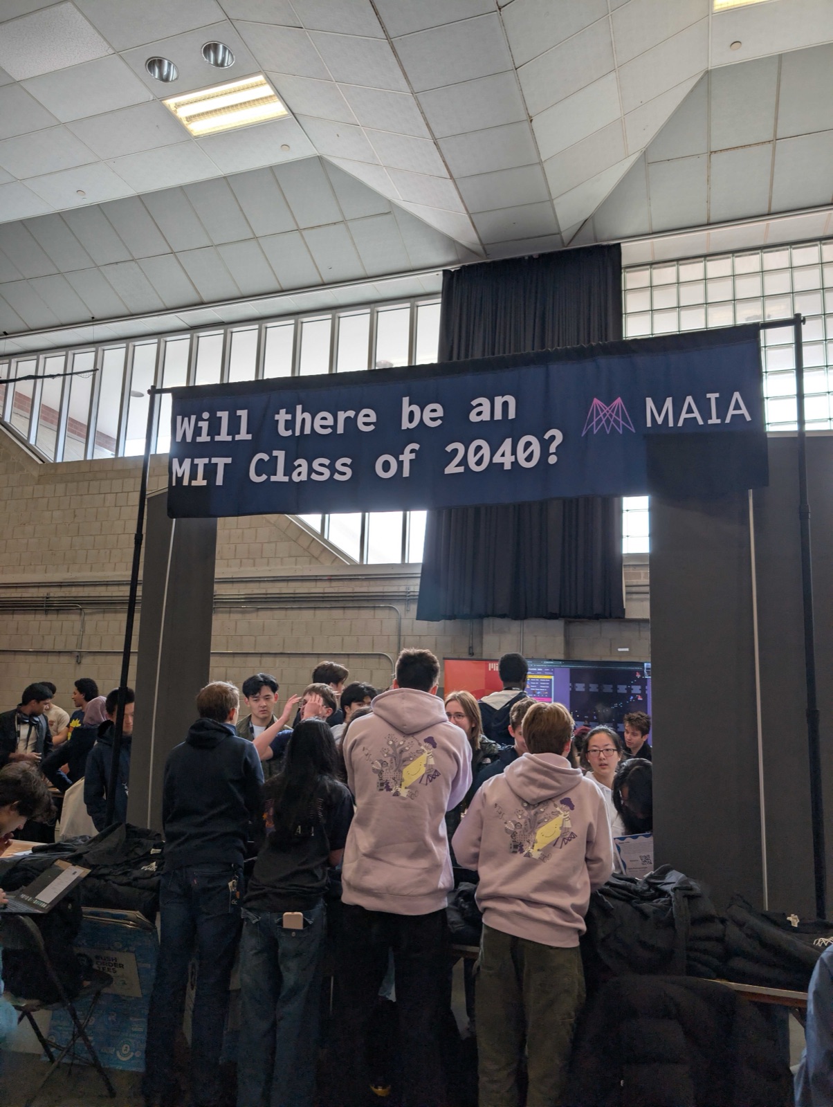 Visitors at MAIA’s CPW 2026 Midway booth beneath the MIT Class of 2040 banner.